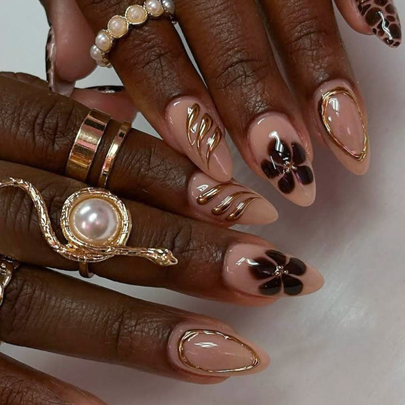 Artistic Press-On Nail Set with Floral and Gold Accents