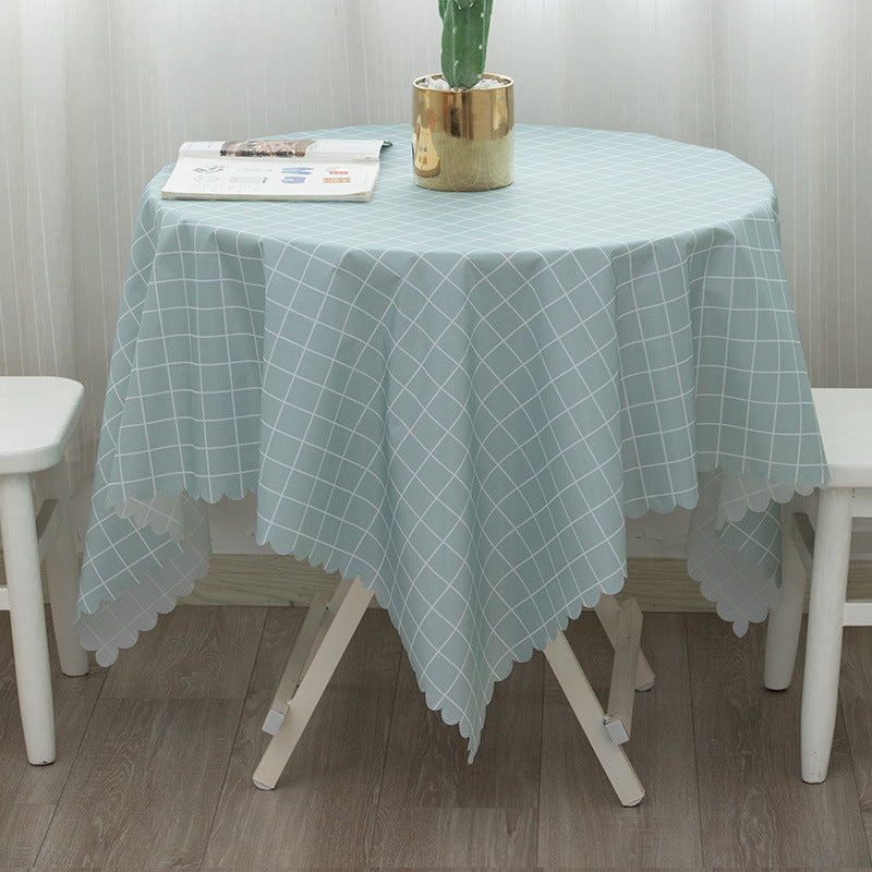 Round washable tablecloth with fine checkered grid pattern and wavy hem