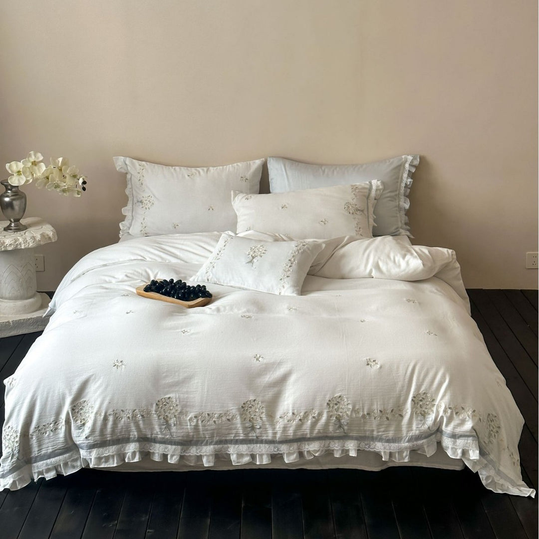 Romantic bedding set with embroidered floral border, ruffled edges and extra soft cotton cover