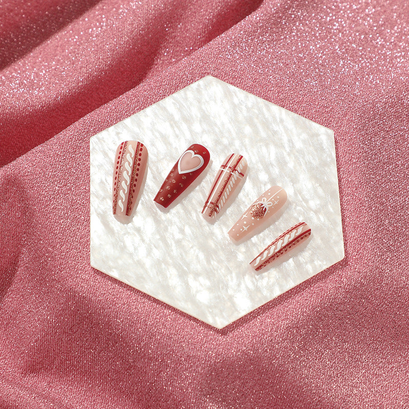Artful nail art in festive design with heart and Christmas motifs Kalsten