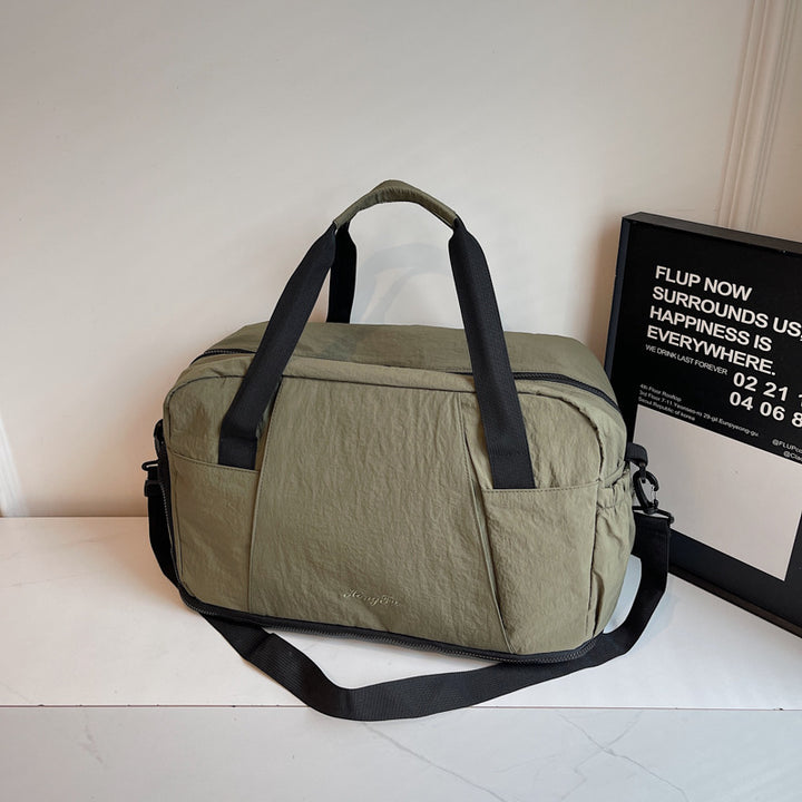 Sporty travel bag with practical outer pockets Kalsten