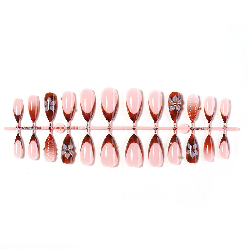 Nail art set with detailed ombre design and creative flower accents Kalsten