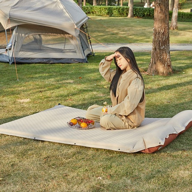 outdoor foldable camping and picnic mat with inflatable cushioned edge and waterproof base Kalsten