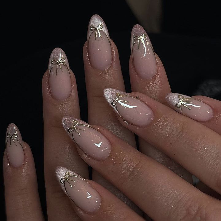 Artificial nail set with shimmering tips and elegant bows Kalsten