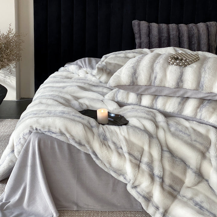 Luxury faux fur throw and cushion set with striped texture