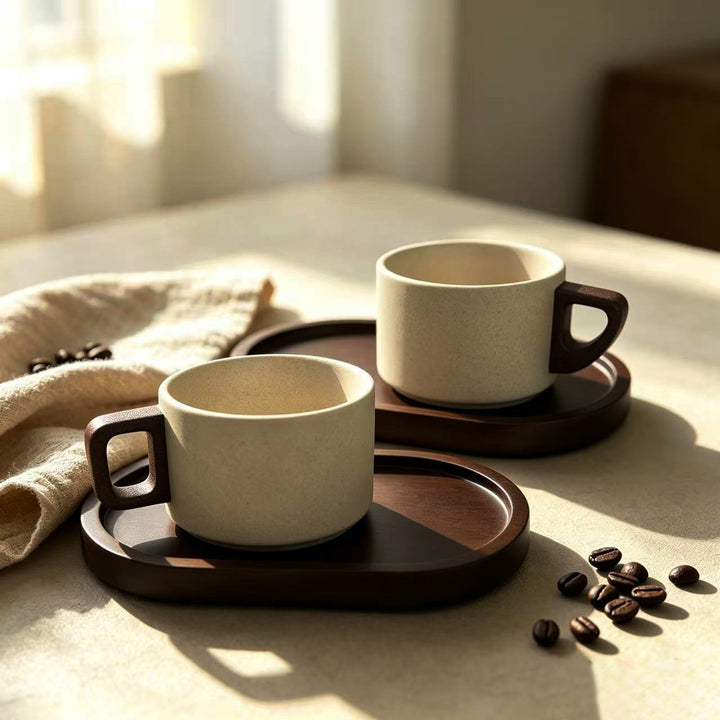 Ceramic mug with ergonomic wooden handle and matching coaster