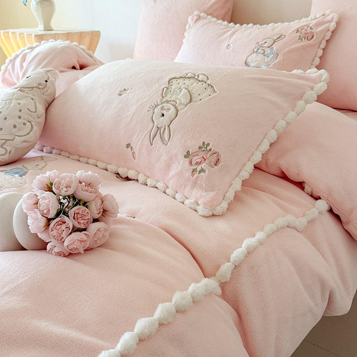Cute cotton bedding set with embroidered bunny appliqués and pom-pom trim