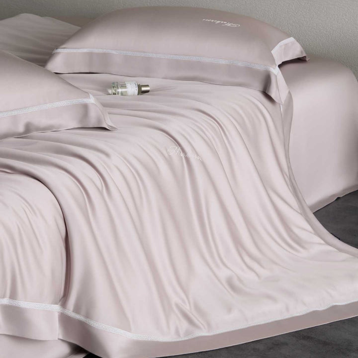 Silky-smooth cotton satin bedding set with fine decorative ribbon and pillowcases