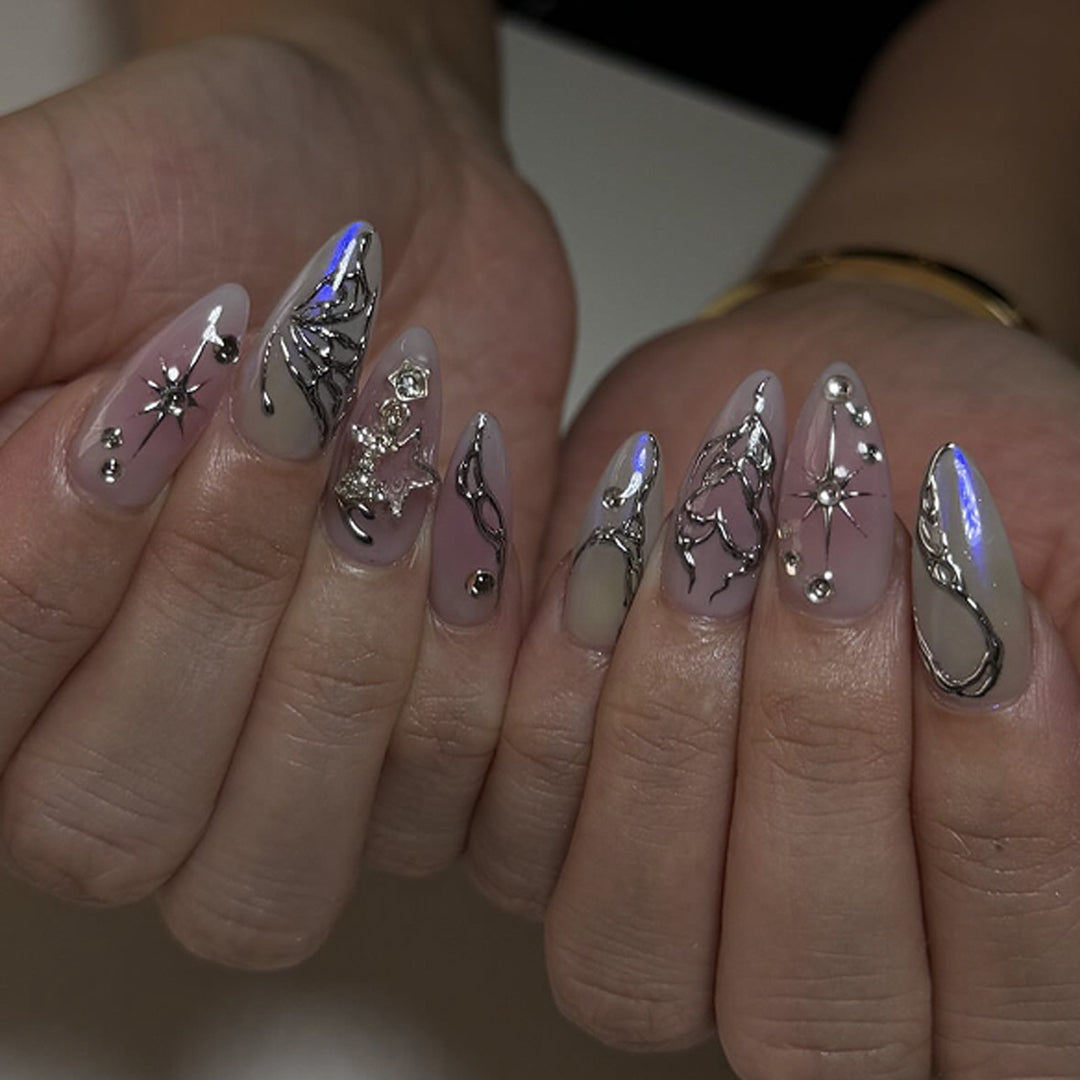 Artistic nail art with unique 3D decorations and glitter accents Kalsten