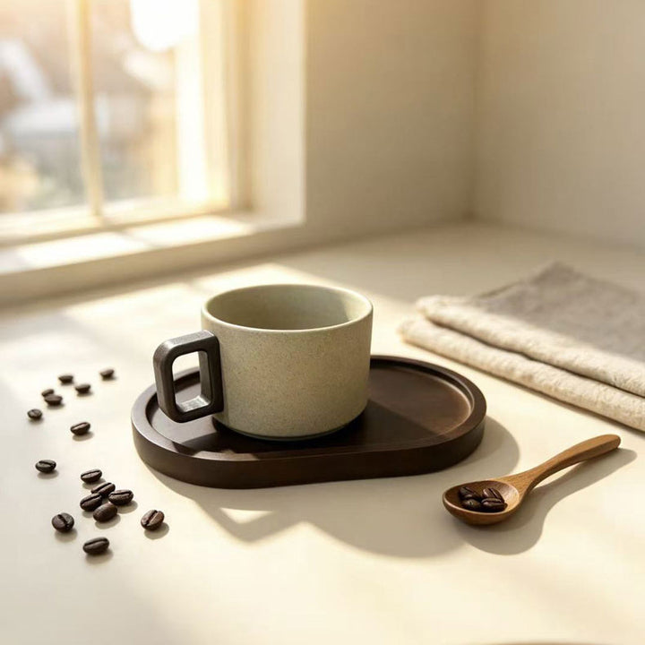 Ceramic mug with wooden handle and saucer