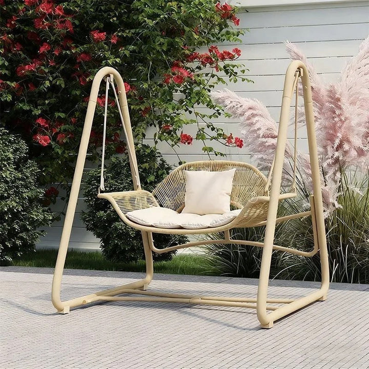 Woven rattan outdoor swing loveseat with padded cushions and powder-coated steel frame Kalsten