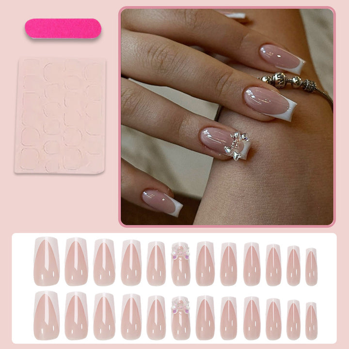 Artificial nail set with luxurious French tips and elegant jewelry embellishments Kalsten