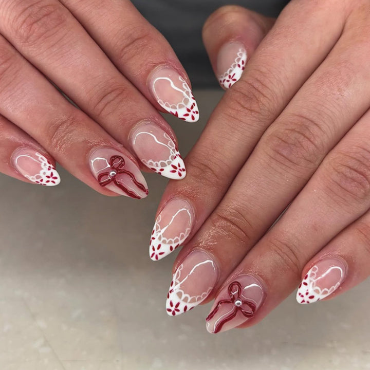 Artful acrylic nails with elegant floral accents Kalsten