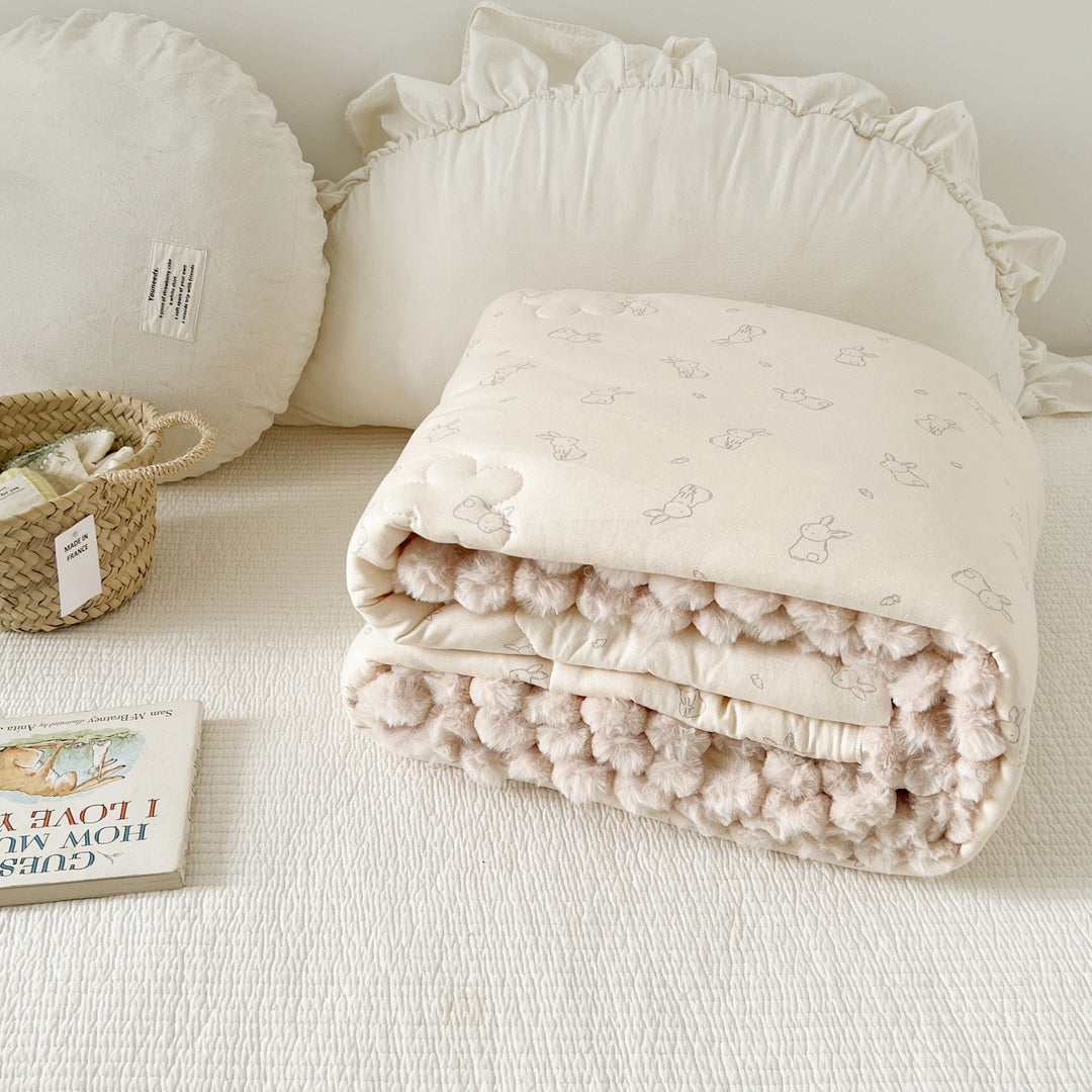 Cuddle blanket baby quilt with plush lining and bunny motif