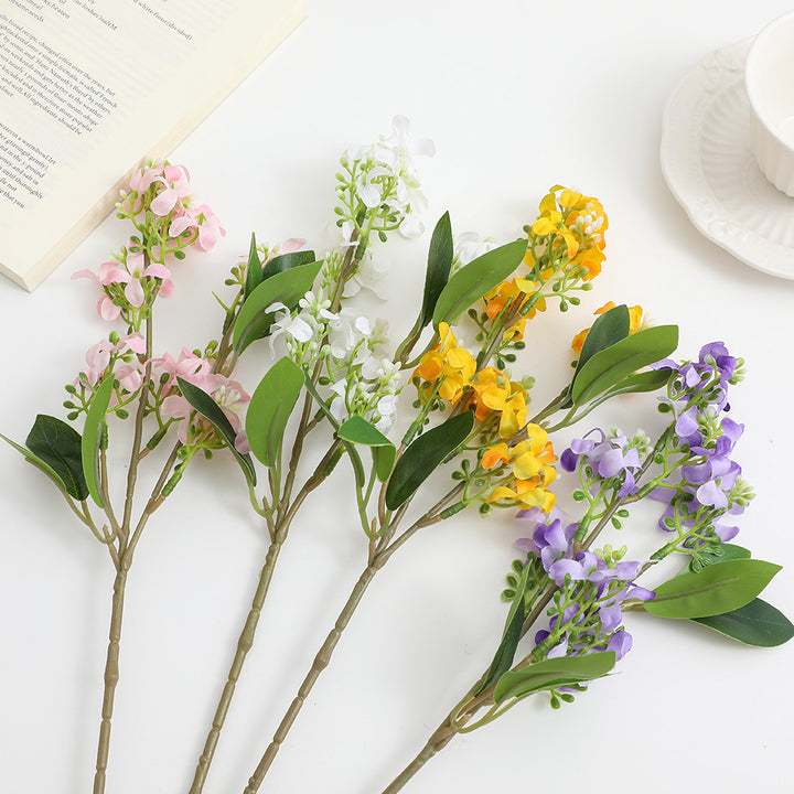 Artificial flower branch with bright flowers