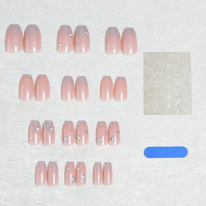 Glamorous artificial nails with glitter and rhinestone embellishments Kalsten