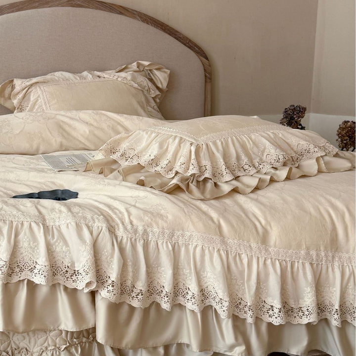 Vintage-inspired bedding set with layered ruffles and lace inset