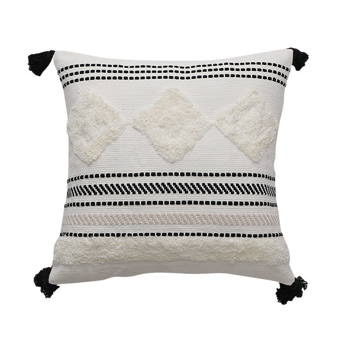 Decorative cotton cushion with pompom and woven ethnic relief