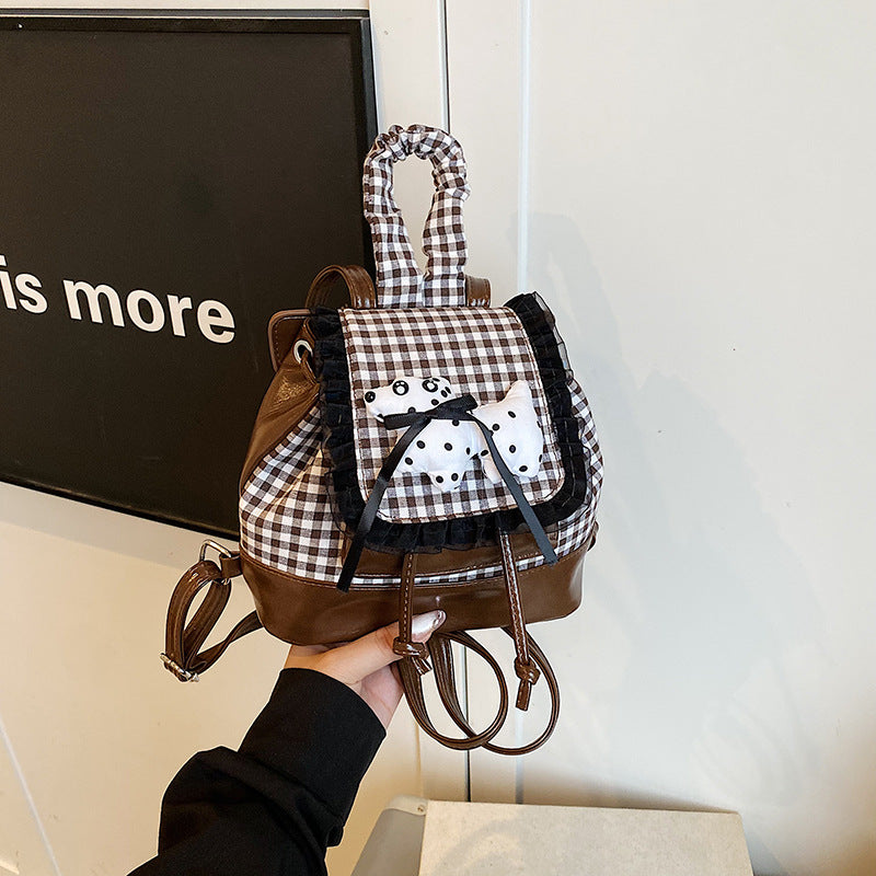 Playful backpack with checkered pattern and animal appliqué Kalsten