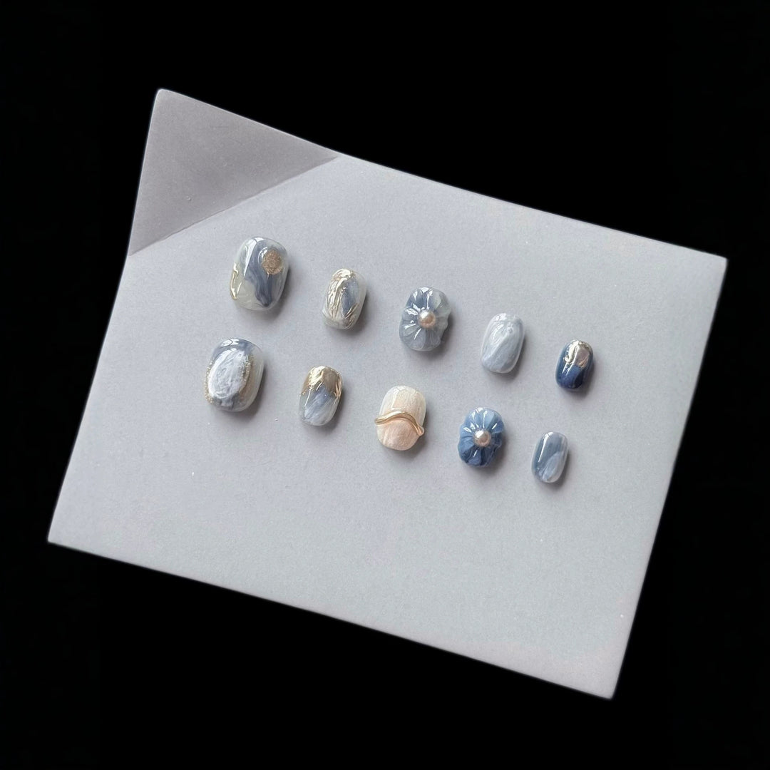 Artistic Press-On Nail Art Set with Unique Floral and Marble Accents