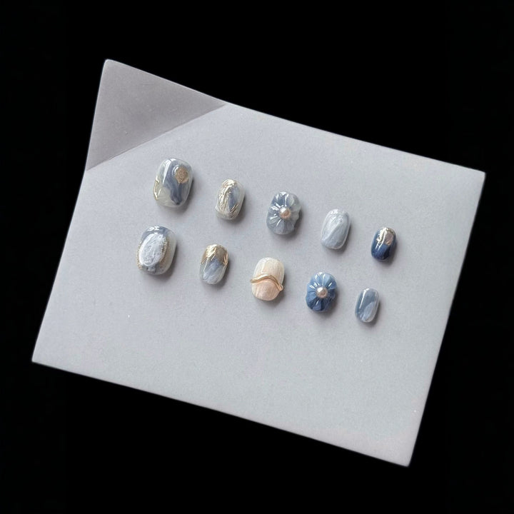 Artistic Press-On Nail Art Set with Unique Floral and Marble Accents