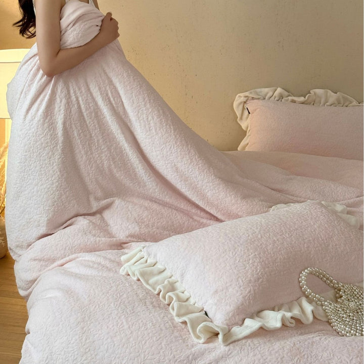 Bedding set with ruffle border and textured cotton blend