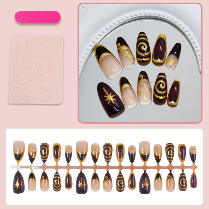 Acrylic nail set with elegant spiral patterns and glamorous golden accents Kalsten