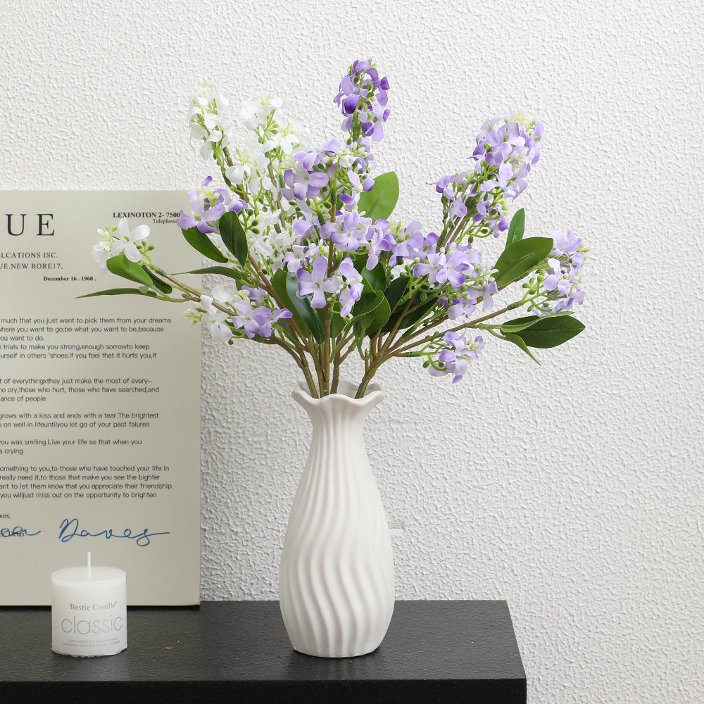 Artificial flower branch with bright flowers
