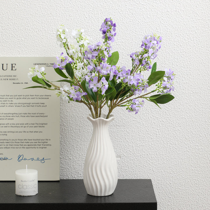 Artificial flower branch with bright flowers