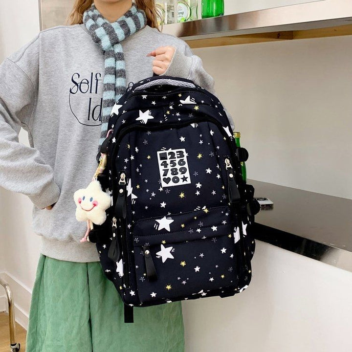 Playful backpack with star motifs and practical functions Kalsten