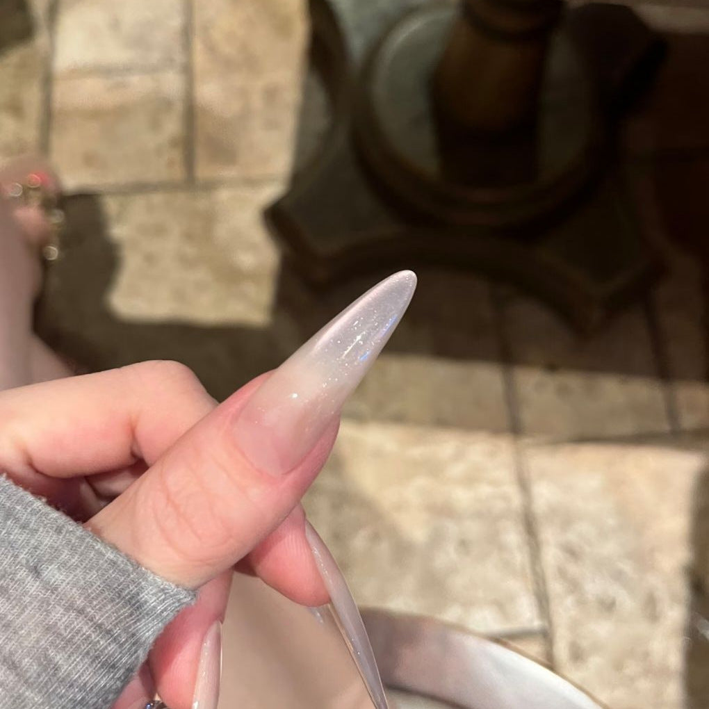 Glamorous Stiletto Nail Art Extensions with Decorative Accents