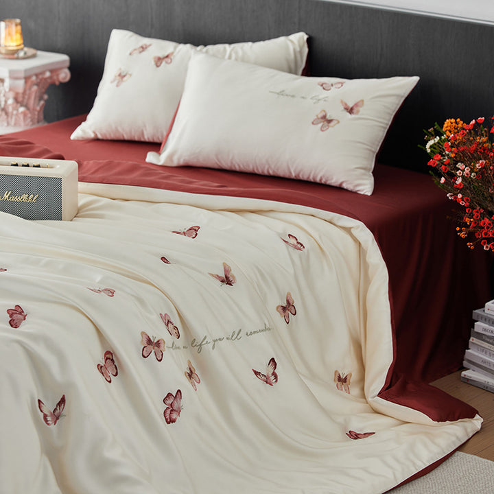Luxurious cotton satin duvet cover set with embroidered butterfly designs and reversible design