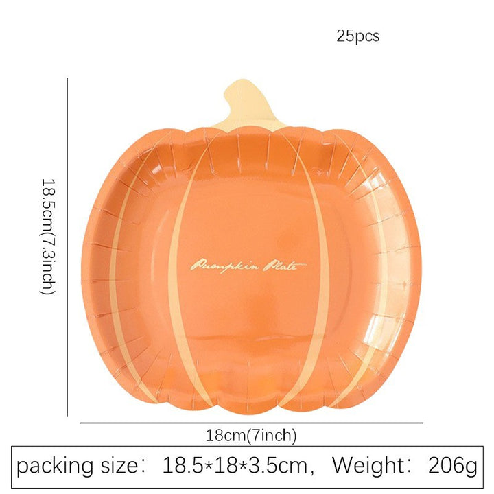 Disposable paper plates in pumpkin shape with spooky face design