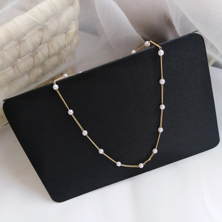 Delicate Pearl Necklace with Fine Gold Stand Kalsten