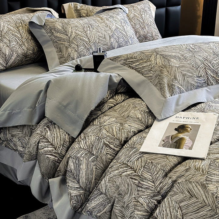 Elegant bed linen set made of cotton satin with a subtle leaf pattern and contrast piping