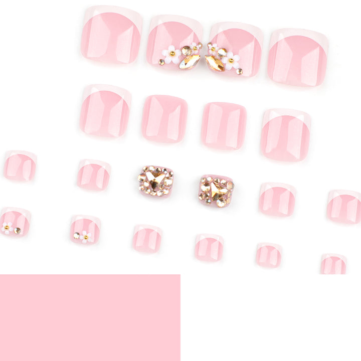 Artistic toenail art with elegant flower and glitter accents Kalsten