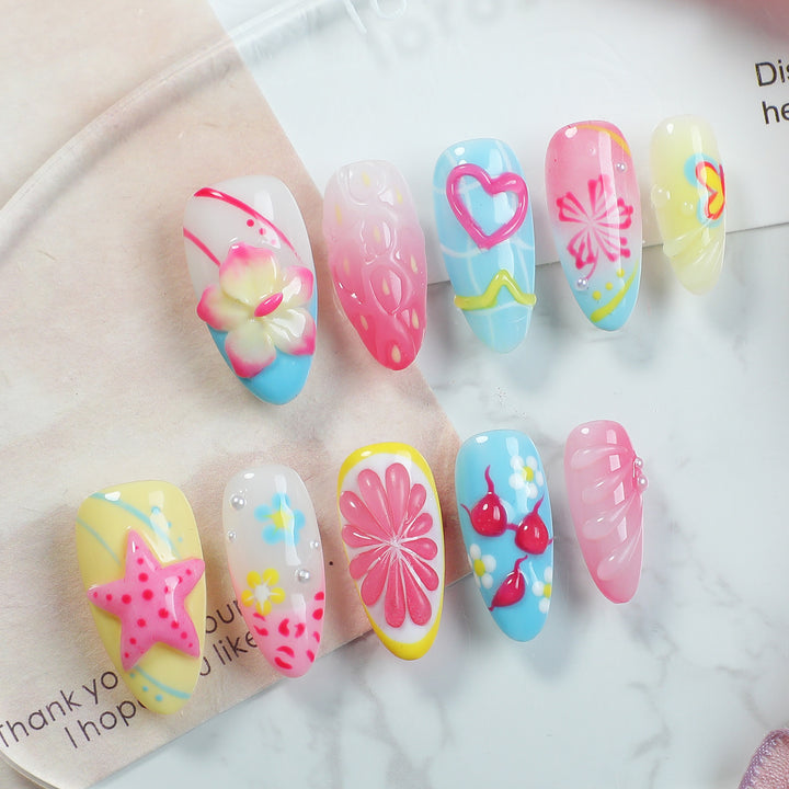 Creative nail art set with playful floral design and glitter effects Kalsten