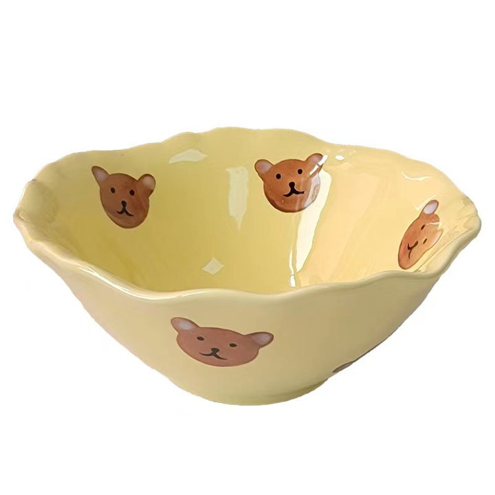 Decorative hand-painted ceramic bowl with wavy edge and tulip design