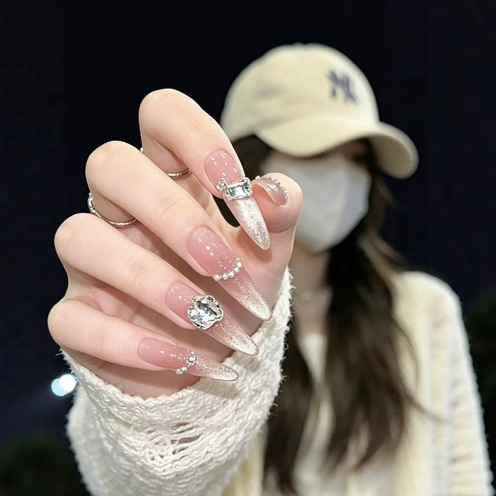 Artistic Stiletto Nail Enhancements with Gemstone Accents
