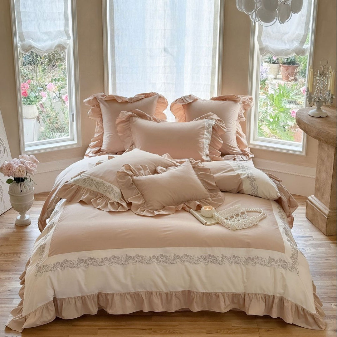 Designer bed linen set with ruffle hem and fine border embroidery