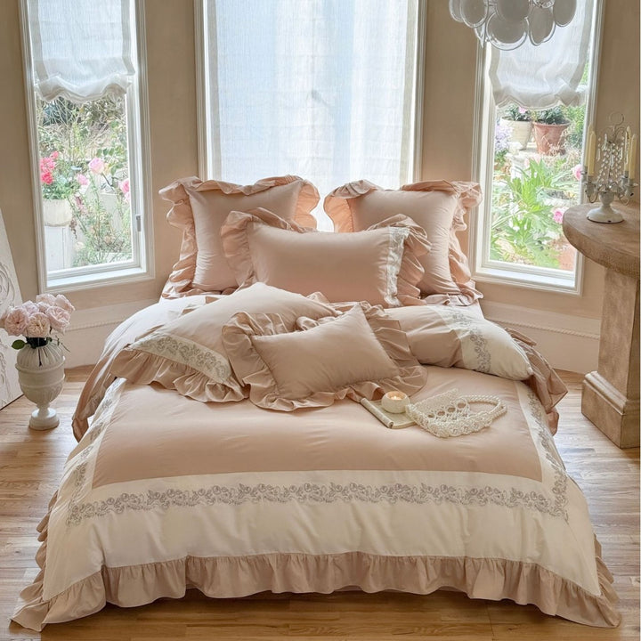 Designer bed linen set with ruffle hem and fine border embroidery