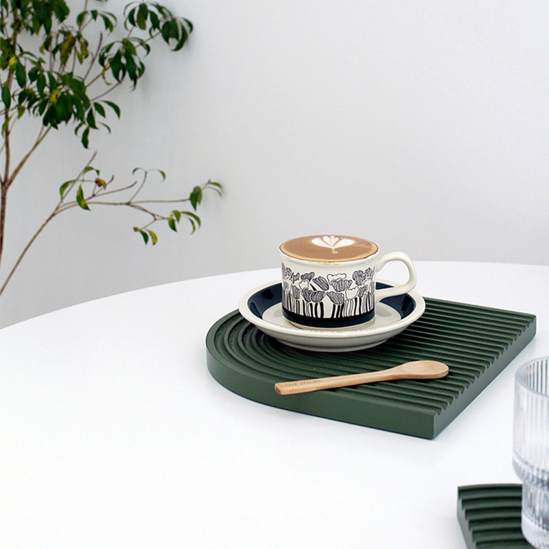 Fine porcelain tea cup with saucer and delicate floral motif