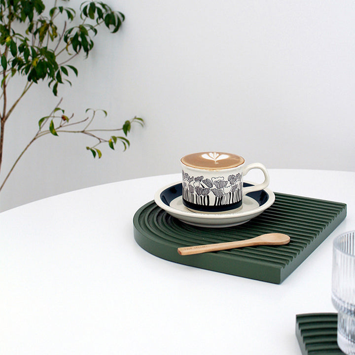 Fine porcelain tea cup with saucer and delicate floral motif