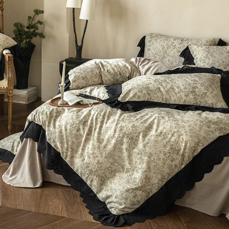 Bedding set with floral toile design and decorative lace trim