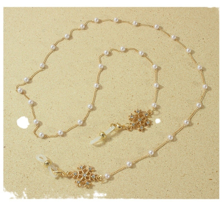 Elegant glasses holder chain with pearls and snowflake pendant Kalsten