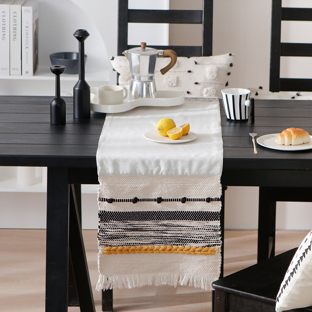 Woven cotton table runner with boho stripes, fringes, and textured woven edge Kalsten