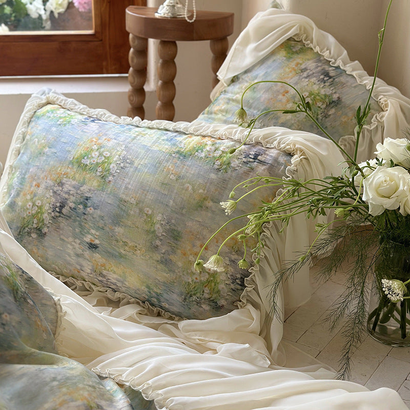 Luxurious quilt set with watercolor floral pattern, ruffled trim and pillowcases