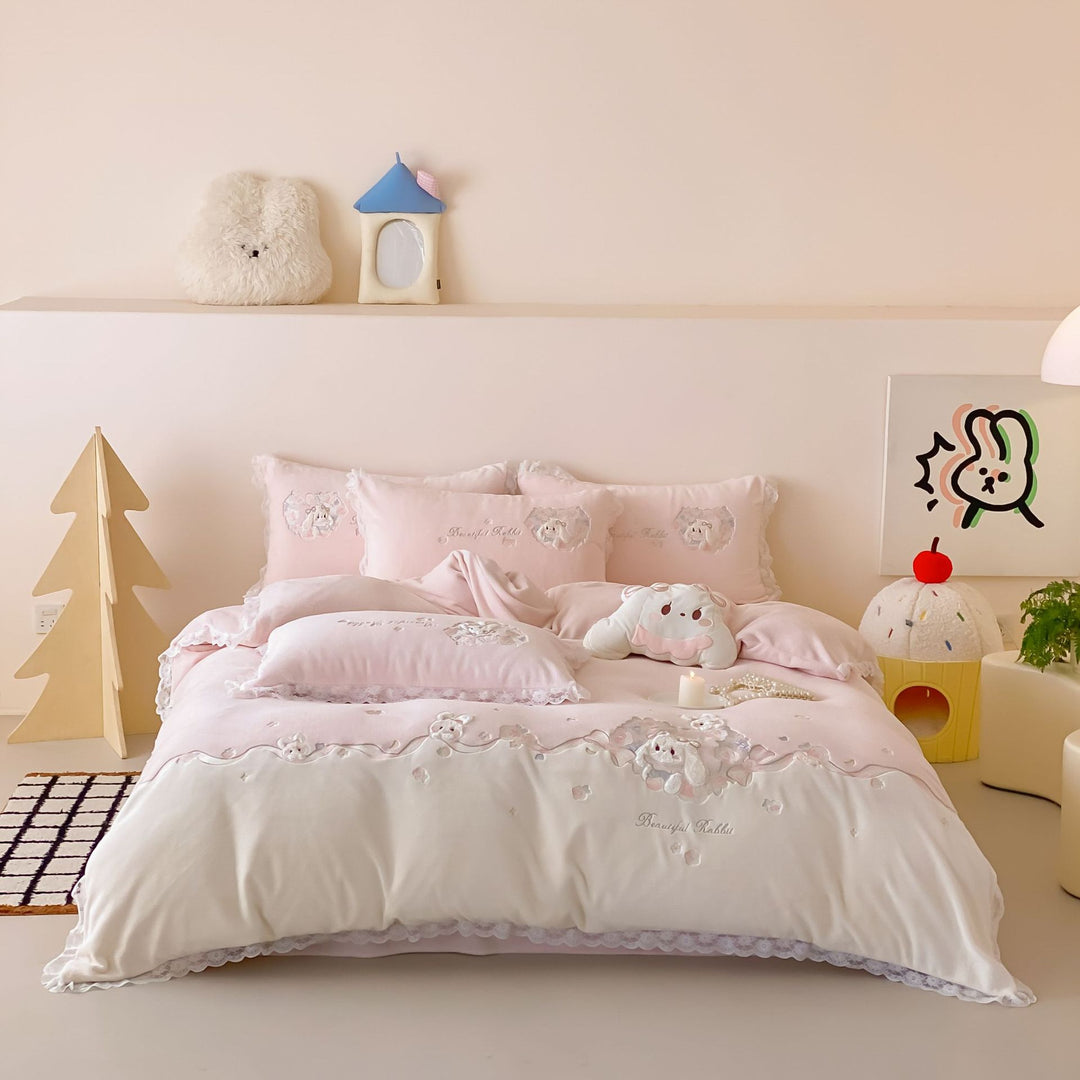 Romantic children's bedding set with embroidered bunny appliqués and lace ruffle