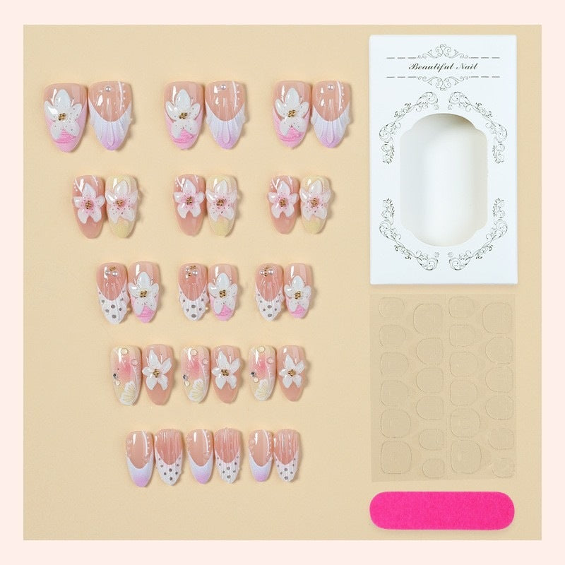 Artificial nail set with delicate floral designs and elegant accents Kalsten