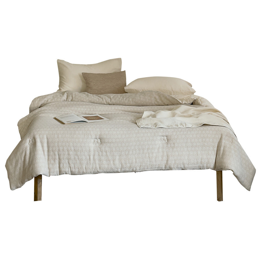 Ultralight thermal quilt with climate-regulating hollow fiber filling